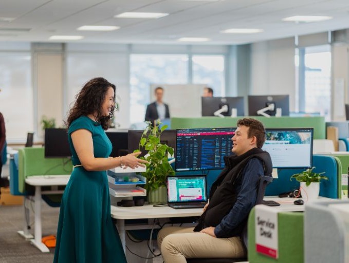 Two people talking in the office