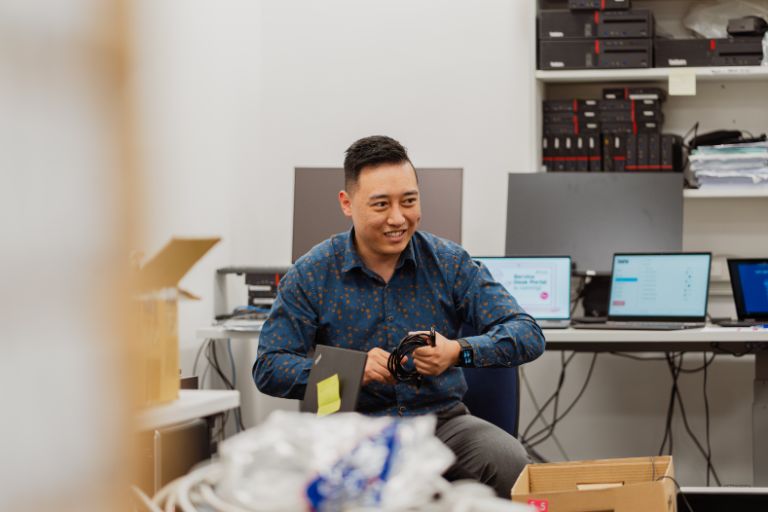 Man sitting with a computer