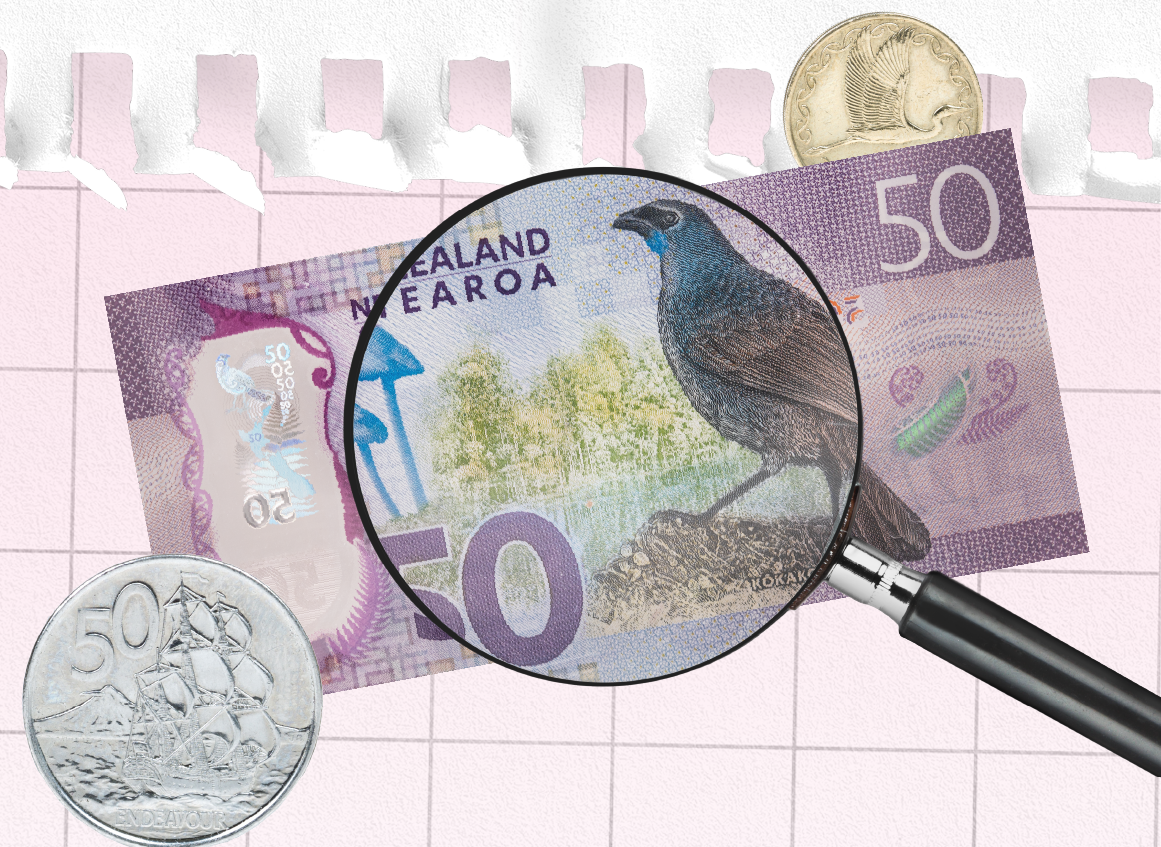 A close-up of a $50 note with a magnifying glass over it