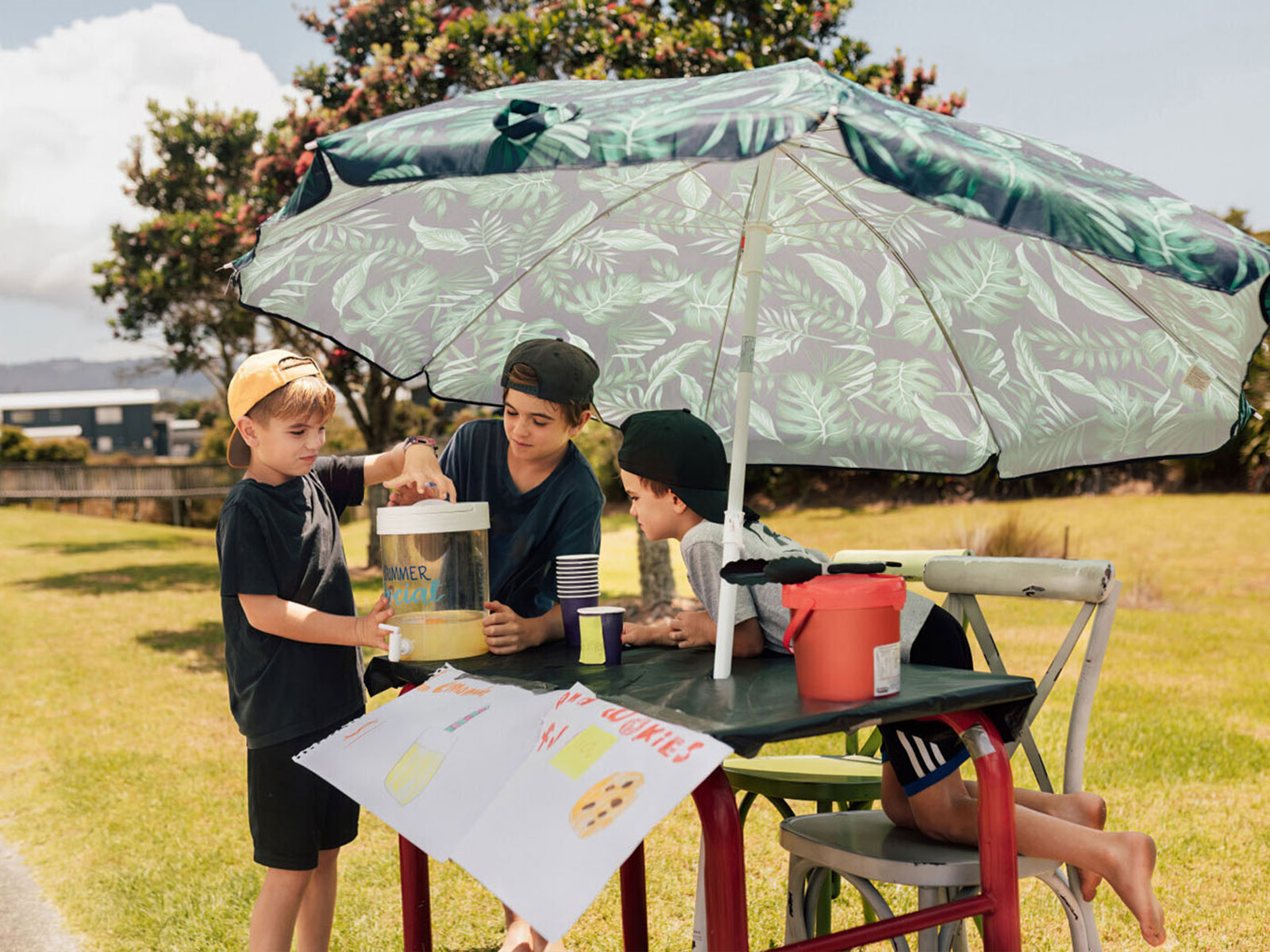 three children working at a lemonade stand
