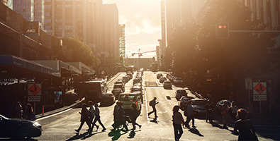 Pedestrians walking on a busy city street
